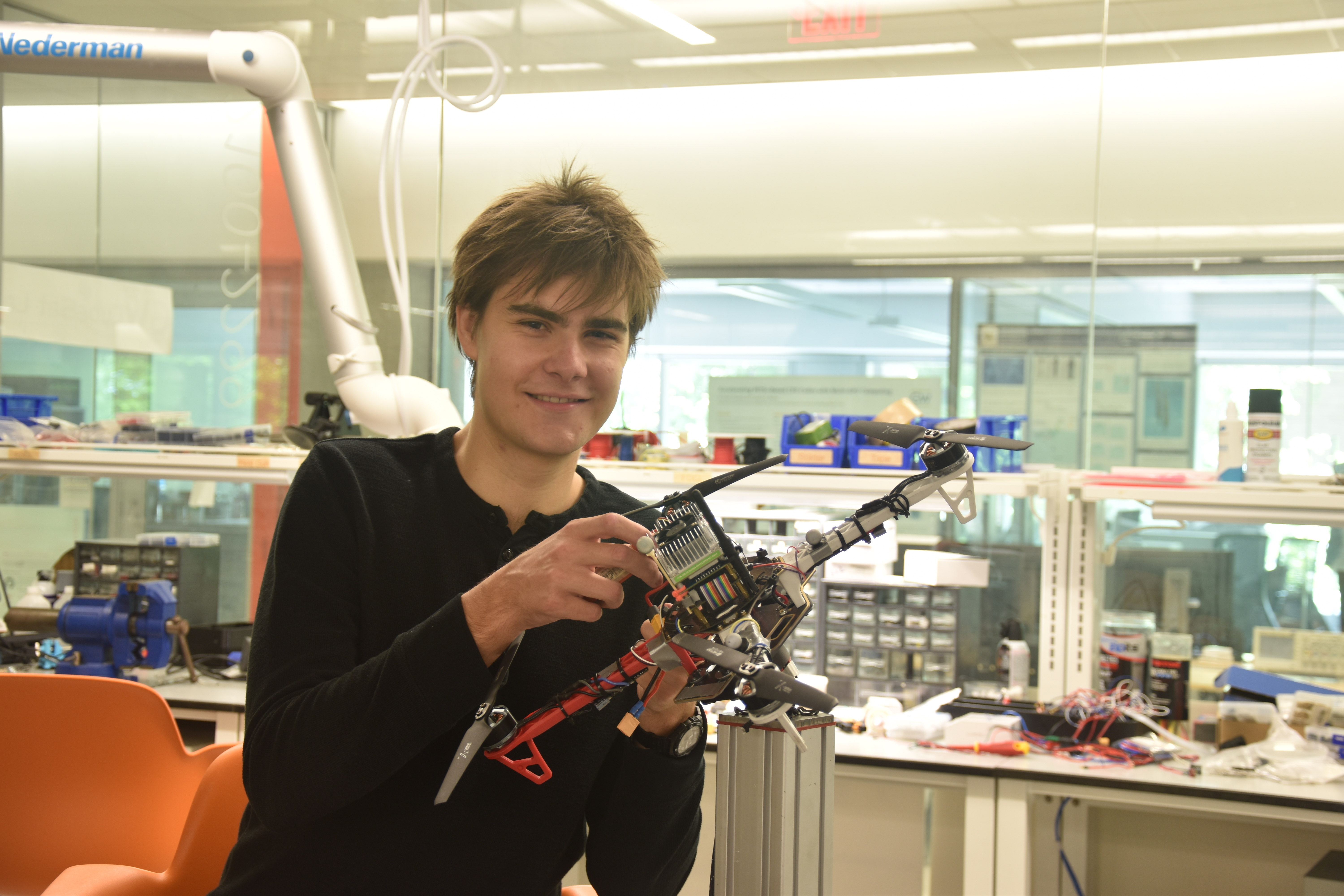 Karl Simon holding a autonomous aerial vehicle