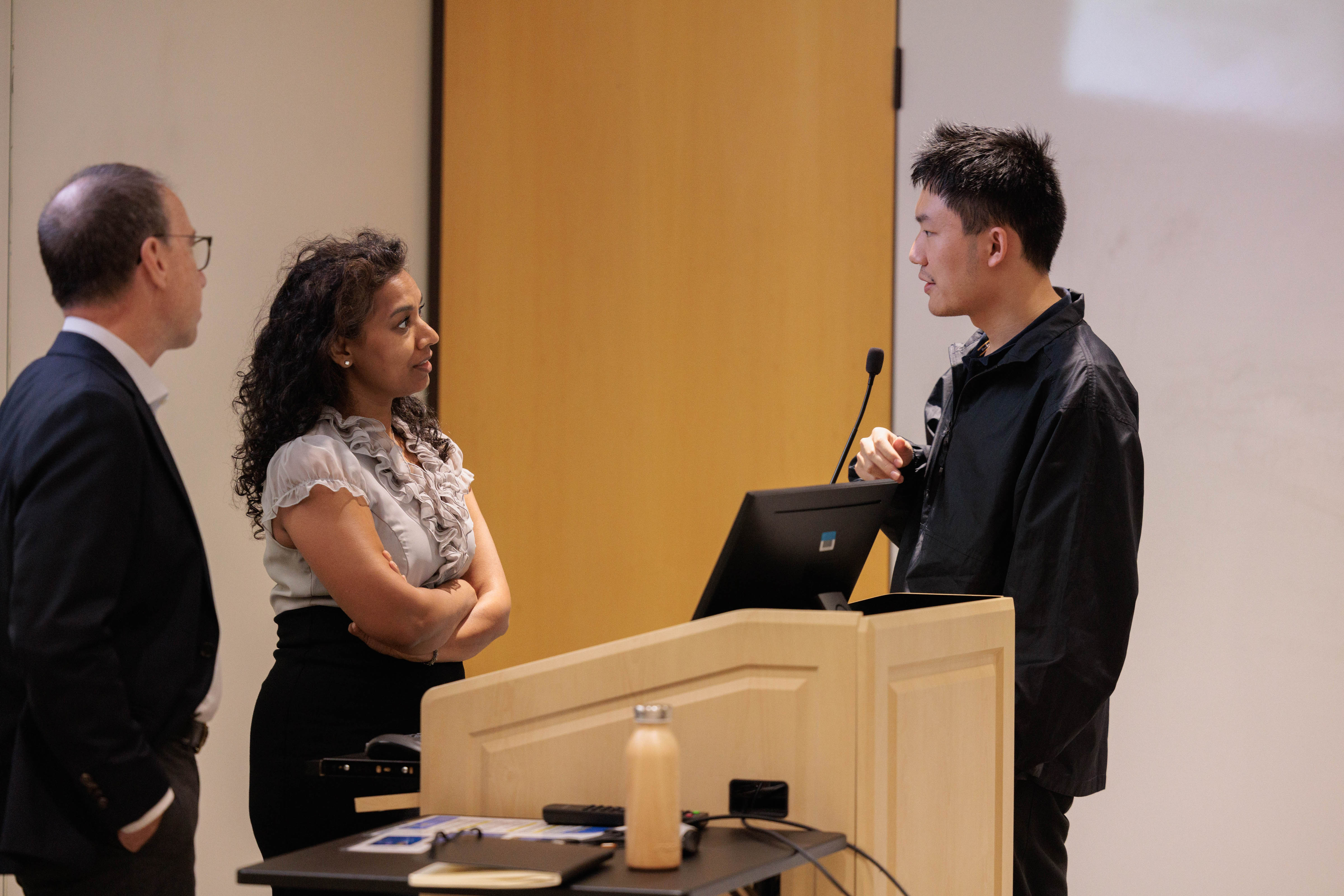 Professor LeBlanc and Professor Russel Korte talking to a student