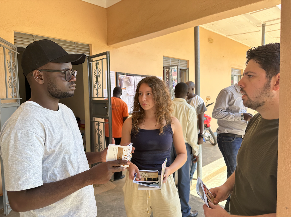 Elmore and Hatcher talking with a community member at the current library