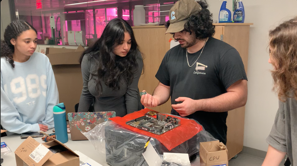 GW Engineering students building and refurbishing the personal computers to be used in the computer lab at the E-Week event.