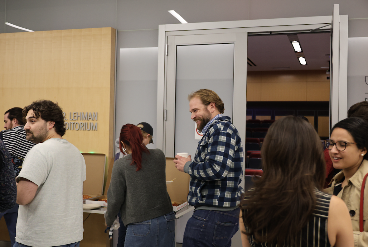 Students getting pizza after the seminar