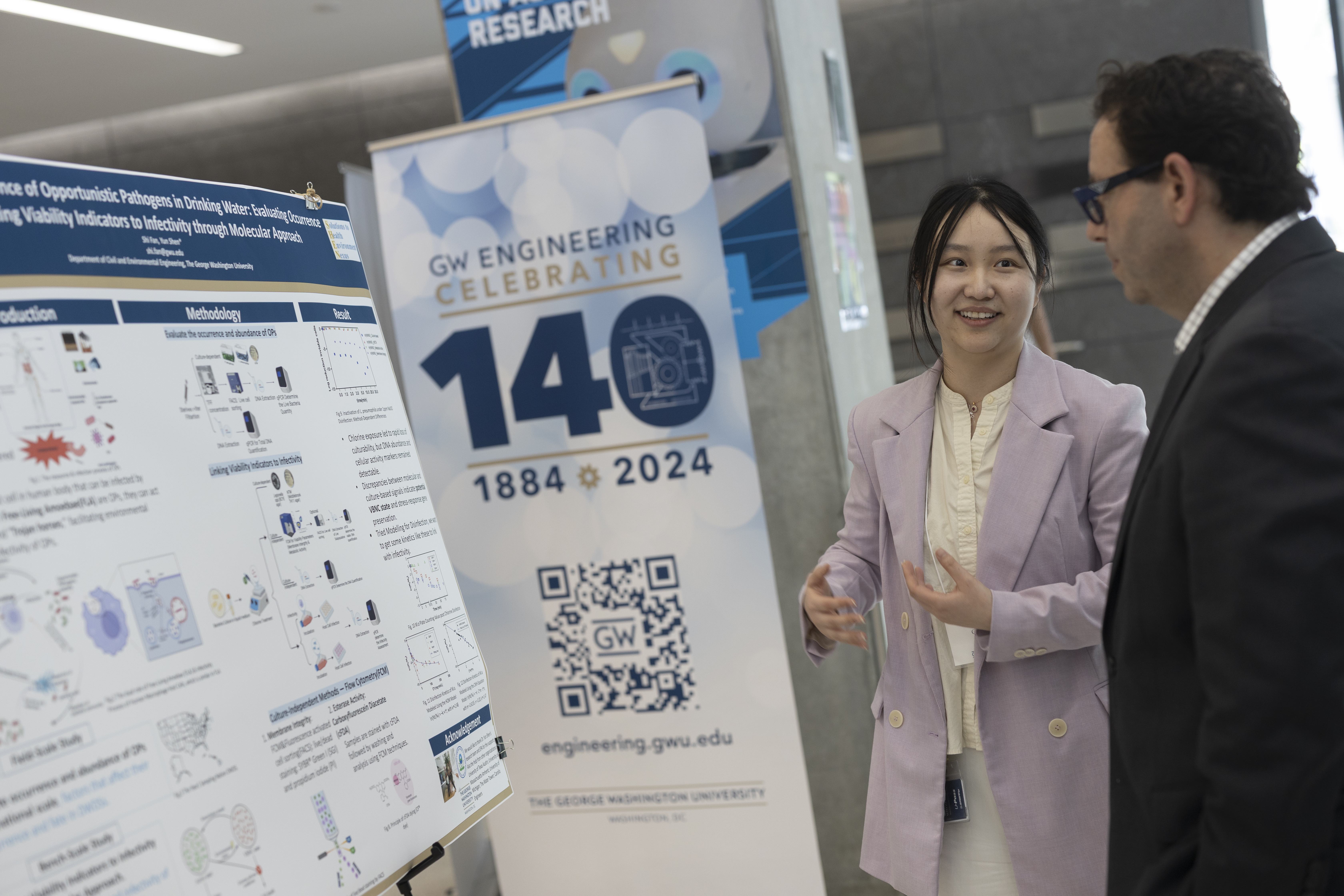 Student talking with a showcase attendee