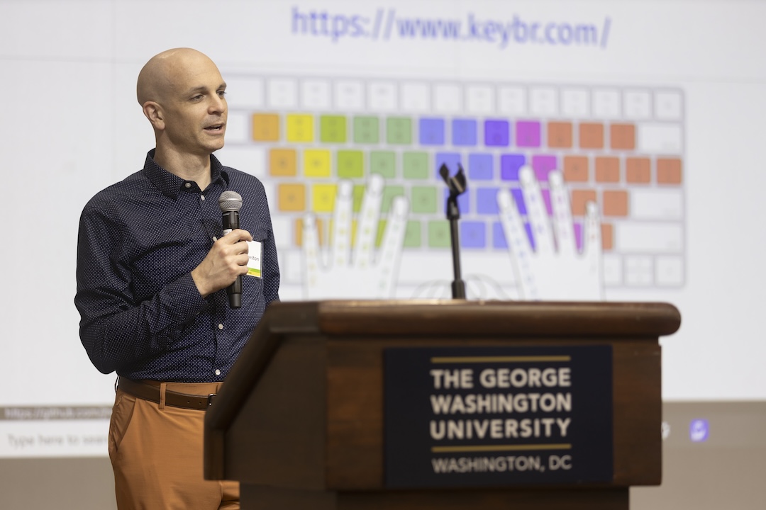 Man speaking at a podium 