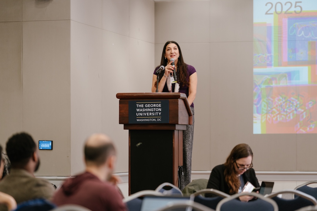 Female speaking at a podium 