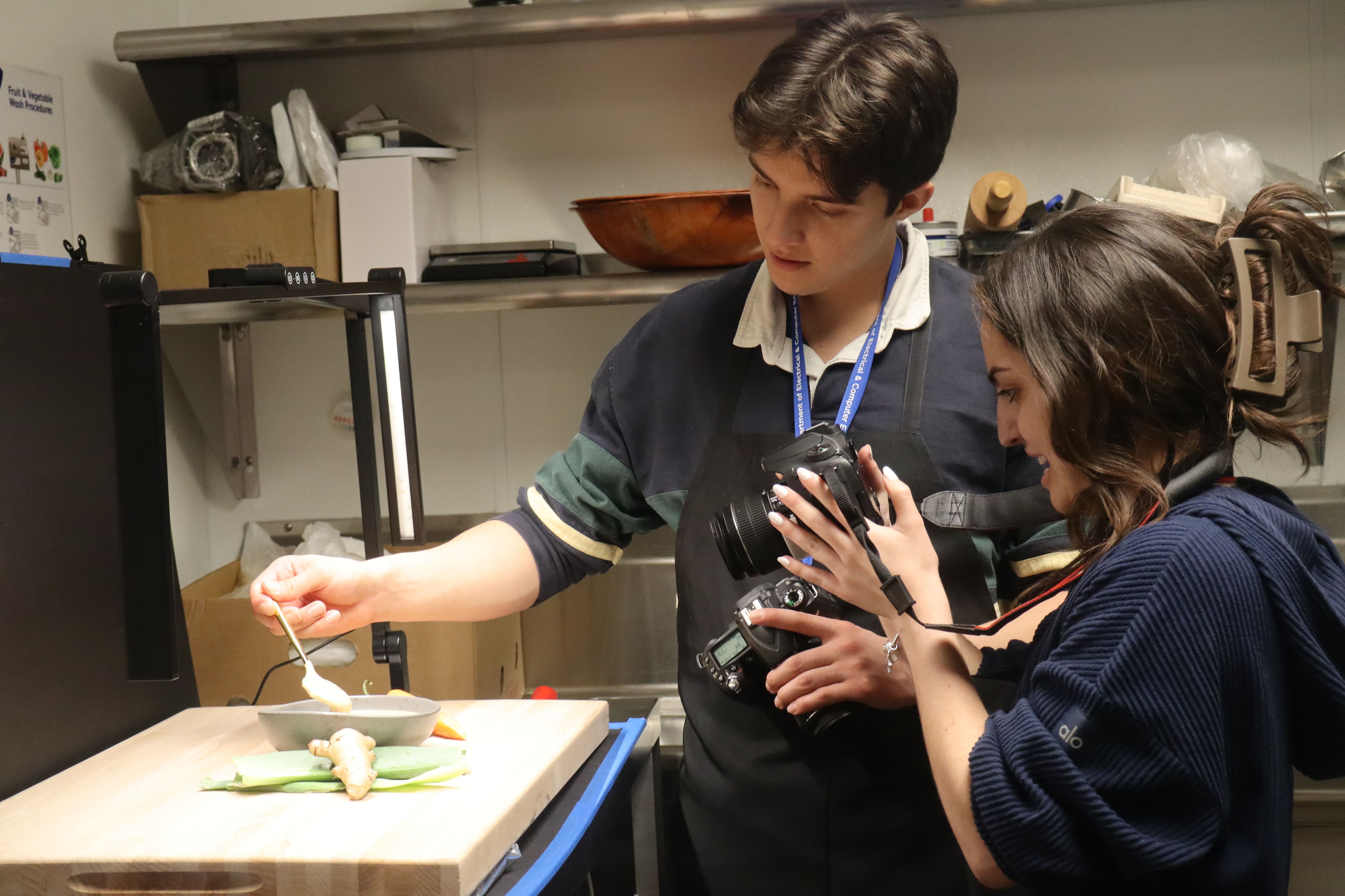 Student photographing the mixing of liquids