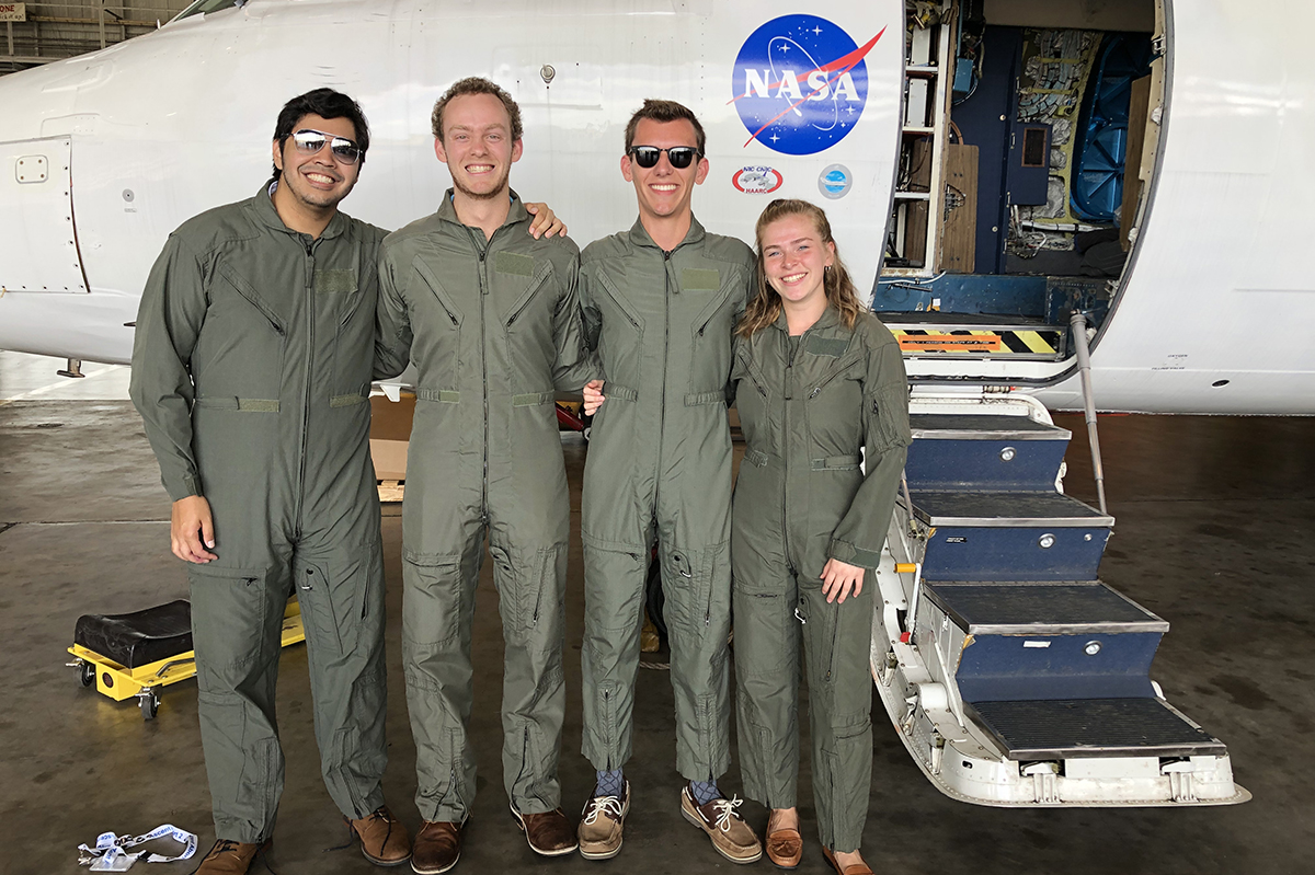 arianna haven and 3 other students stand in front of a NASA aircraft