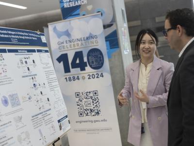 Student talking with a showcase attendee