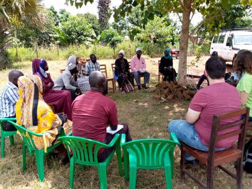 Elmore and Hatcher discussing with Yumbe community members to get a holistic picture of their needs.