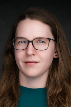 Female professor in green shirt
