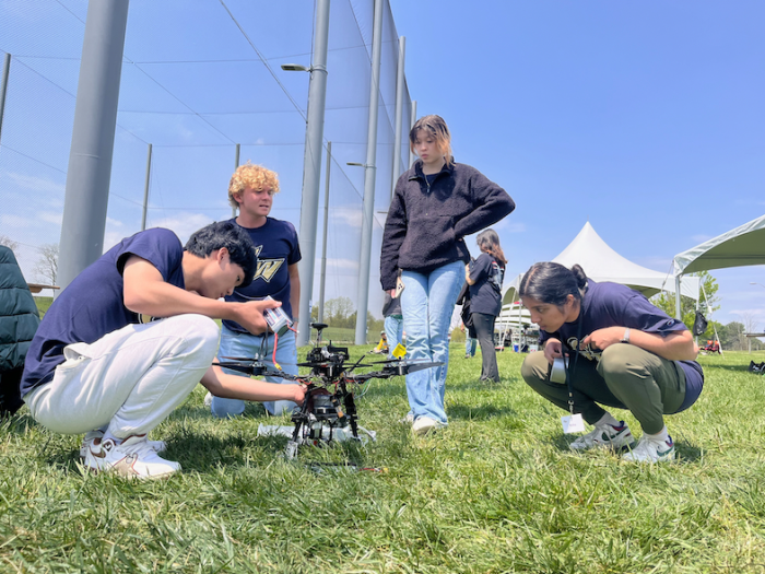 Members of the CS-MAE team preparing for the competition at Virginia Tech