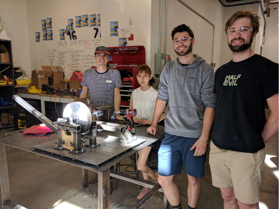 group of students posing in the machine shop