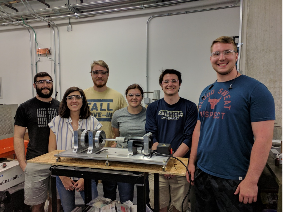 group of students posing in the machine shop