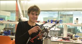 Karl Simon holding a autonomous aerial vehicle