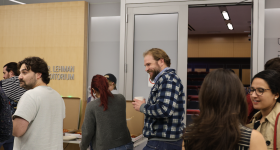 Students getting pizza after the seminar