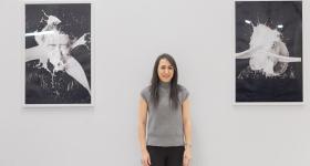 Panah pictured with images from the piece, “The Splash of Milk Streams Impacting a Solid Surface”